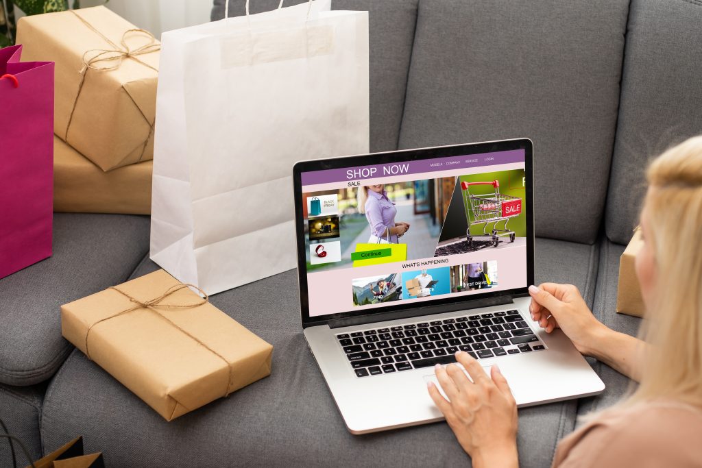 woman shopping online using her laptop home